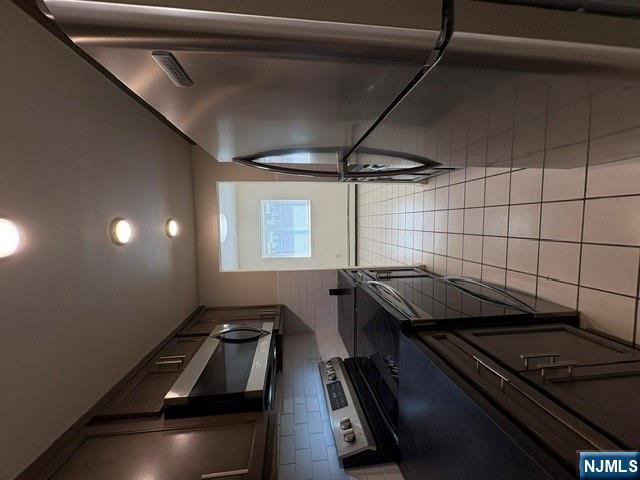 1 Simone Place, Unit 2F Bergenfield, NJ 07621 - Photo 11 of 13 a kitchen with stainless steel appliances granite countertop a stove a refrigerator and a microwave