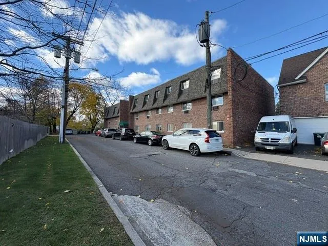 a view of a cars parked in front of a house
