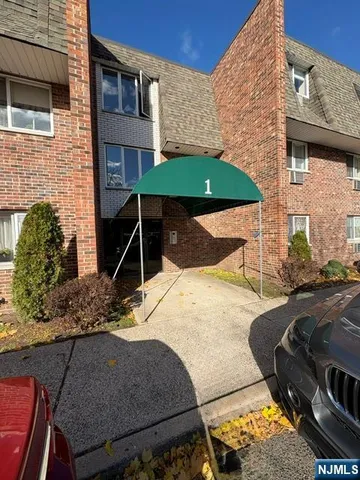 a backyard of a house with barbeque oven table and chairs