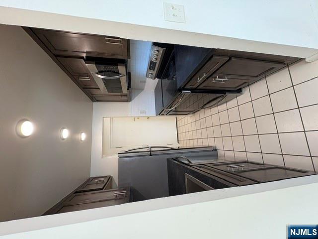 1 Simone Place, Unit 2F Bergenfield, NJ 07621 - Photo 10 of 13 a kitchen with stainless steel appliances a refrigerator and a stove top oven