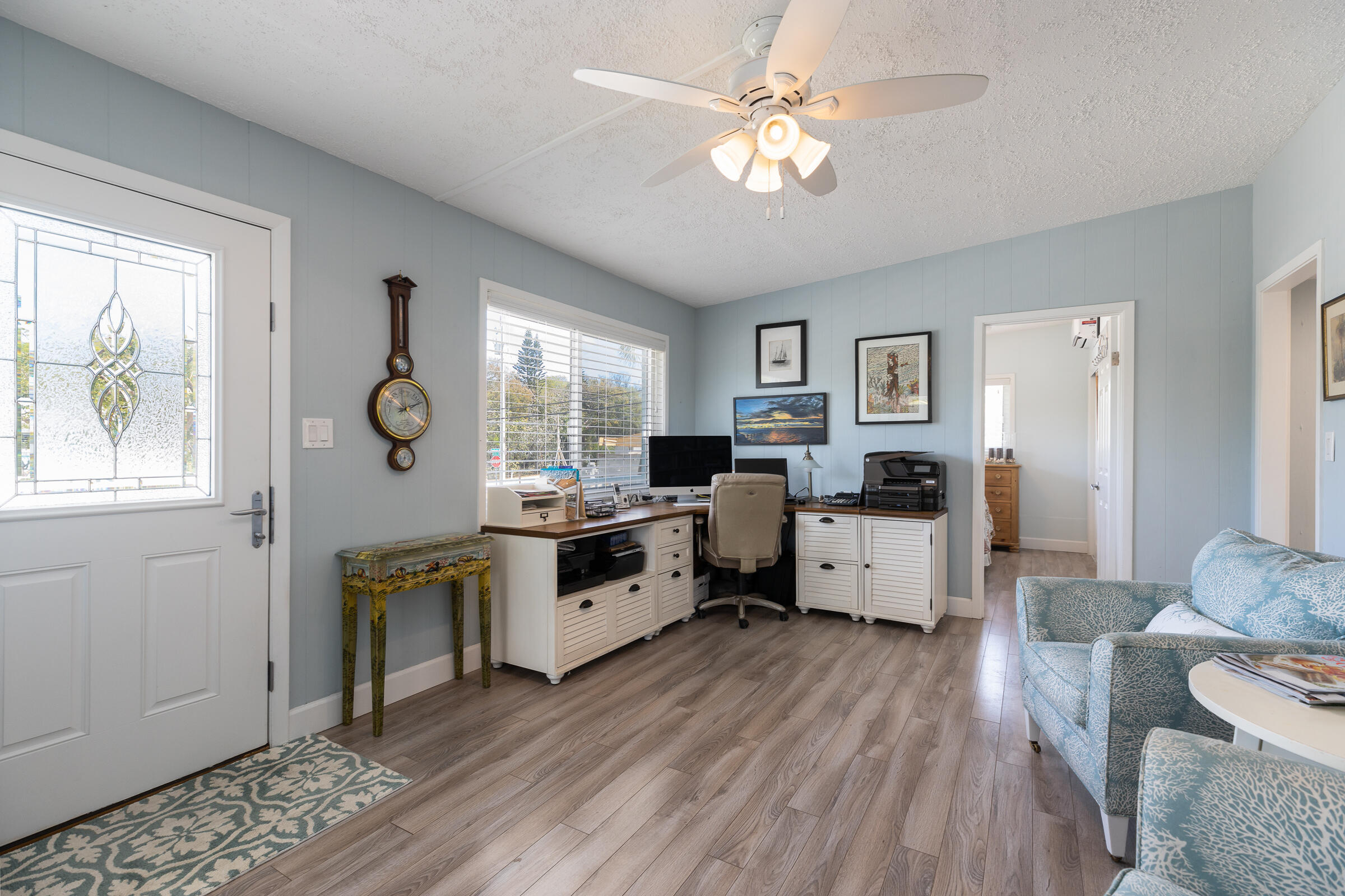 39 Lake Shore Drive Key Largo, FL 33037 - Photo 11 of 47 a kitchen with stainless steel appliances granite countertop a stove top oven a sink dishwasher and white cabinets with wooden floor