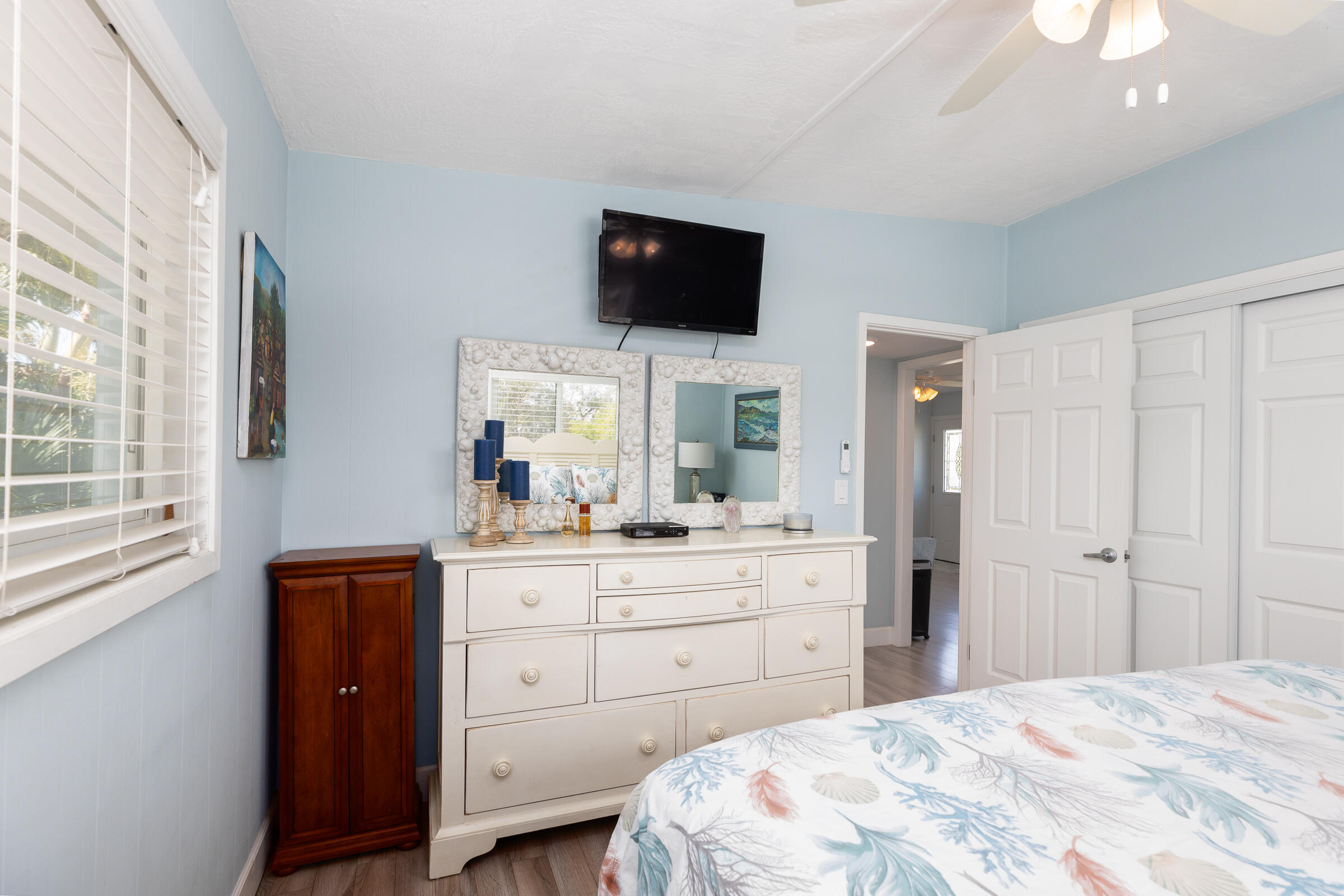 39 Lake Shore Drive Key Largo, FL 33037 - Photo 18 of 47 a bedroom with a bed and a flat screen tv