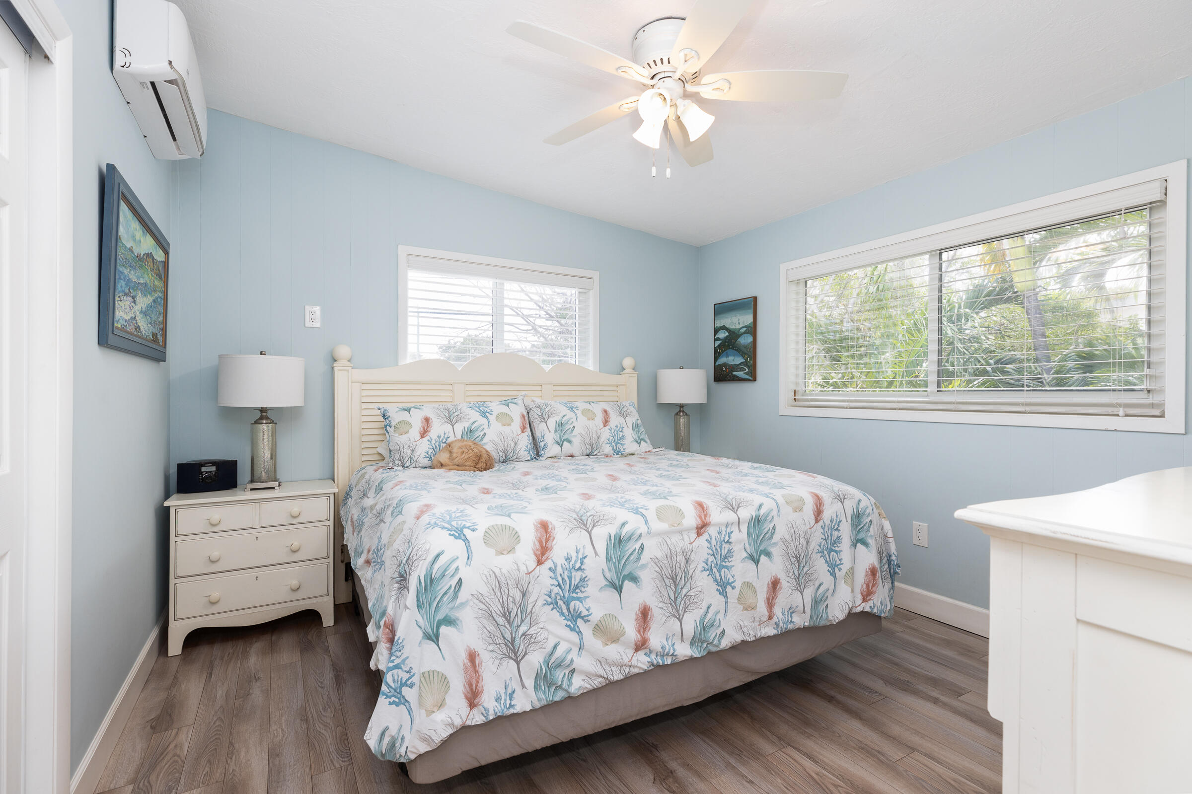 39 Lake Shore Drive Key Largo, FL 33037 - Photo 19 of 47 a bedroom with a bed chandelier and a window
