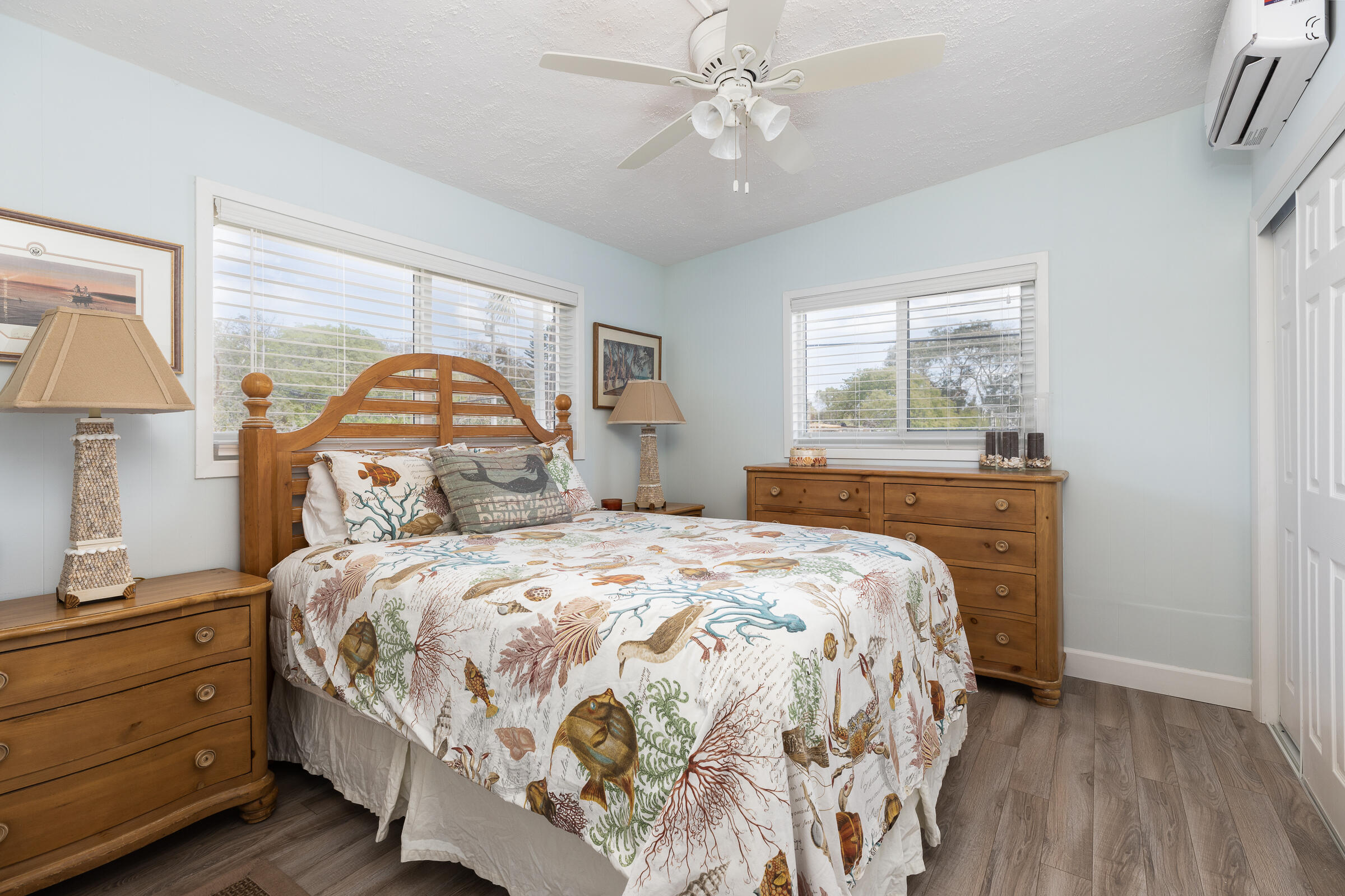 39 Lake Shore Drive Key Largo, FL 33037 - Photo 20 of 47 a bedroom with a bed and a chandelier