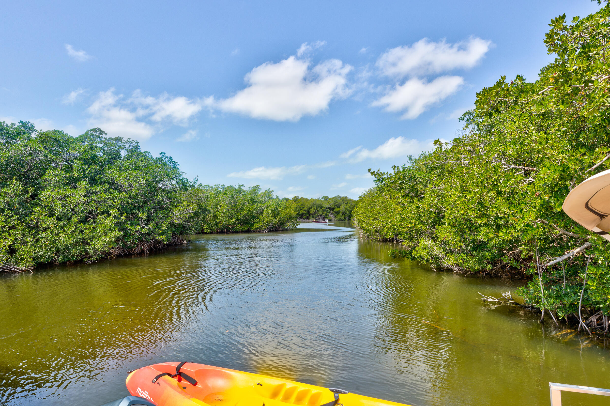 39 Lake Shore Drive Key Largo, FL 33037 - Photo 2 of 47 a view of a lake with houses in the back