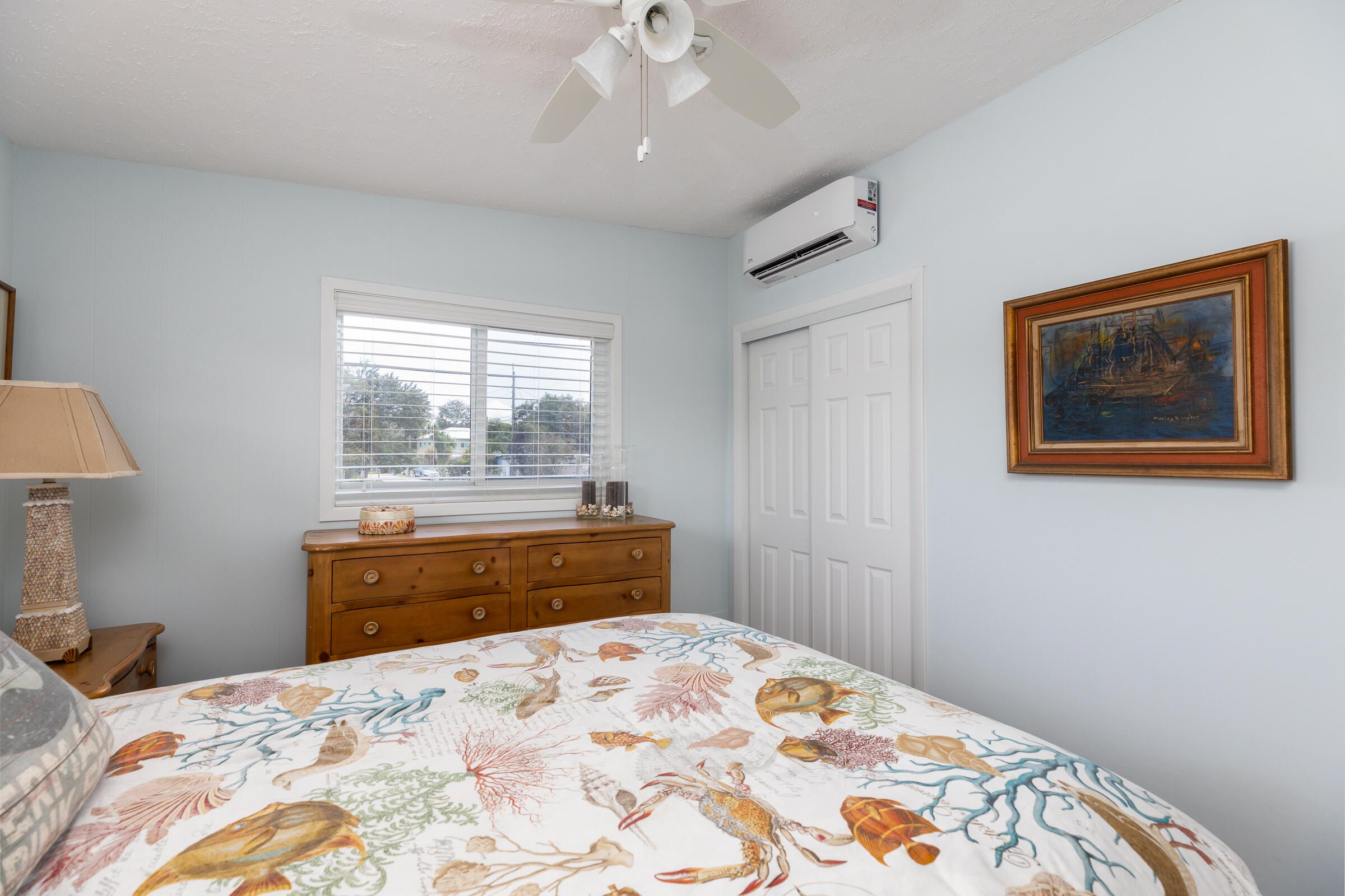 39 Lake Shore Drive Key Largo, FL 33037 - Photo 21 of 47 a bedroom with a large bed and a window