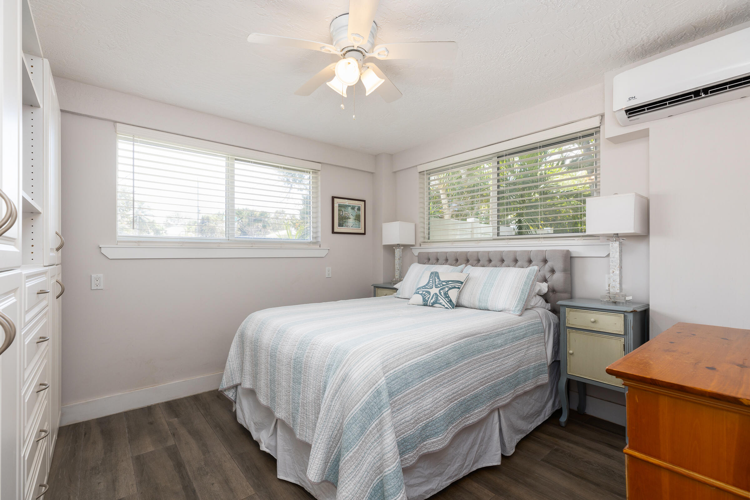 39 Lake Shore Drive Key Largo, FL 33037 - Photo 31 of 47 a bedroom with a bed and a chandelier
