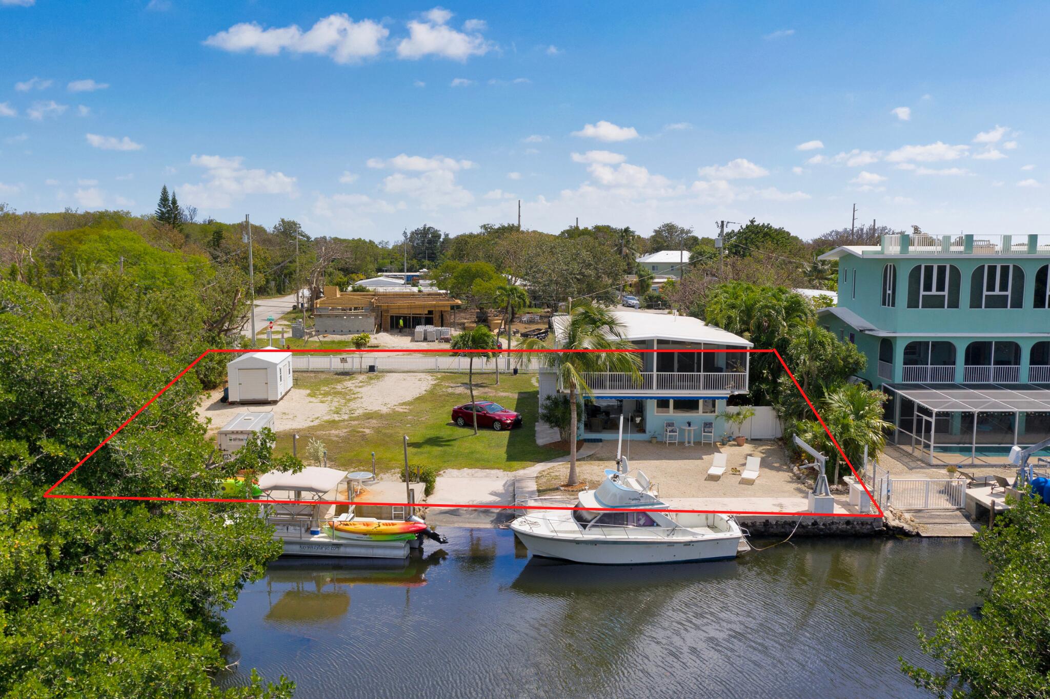 39 Lake Shore Drive Key Largo, FL 33037 - Photo 46 of 47 a view of houses with swimming pool and lake view