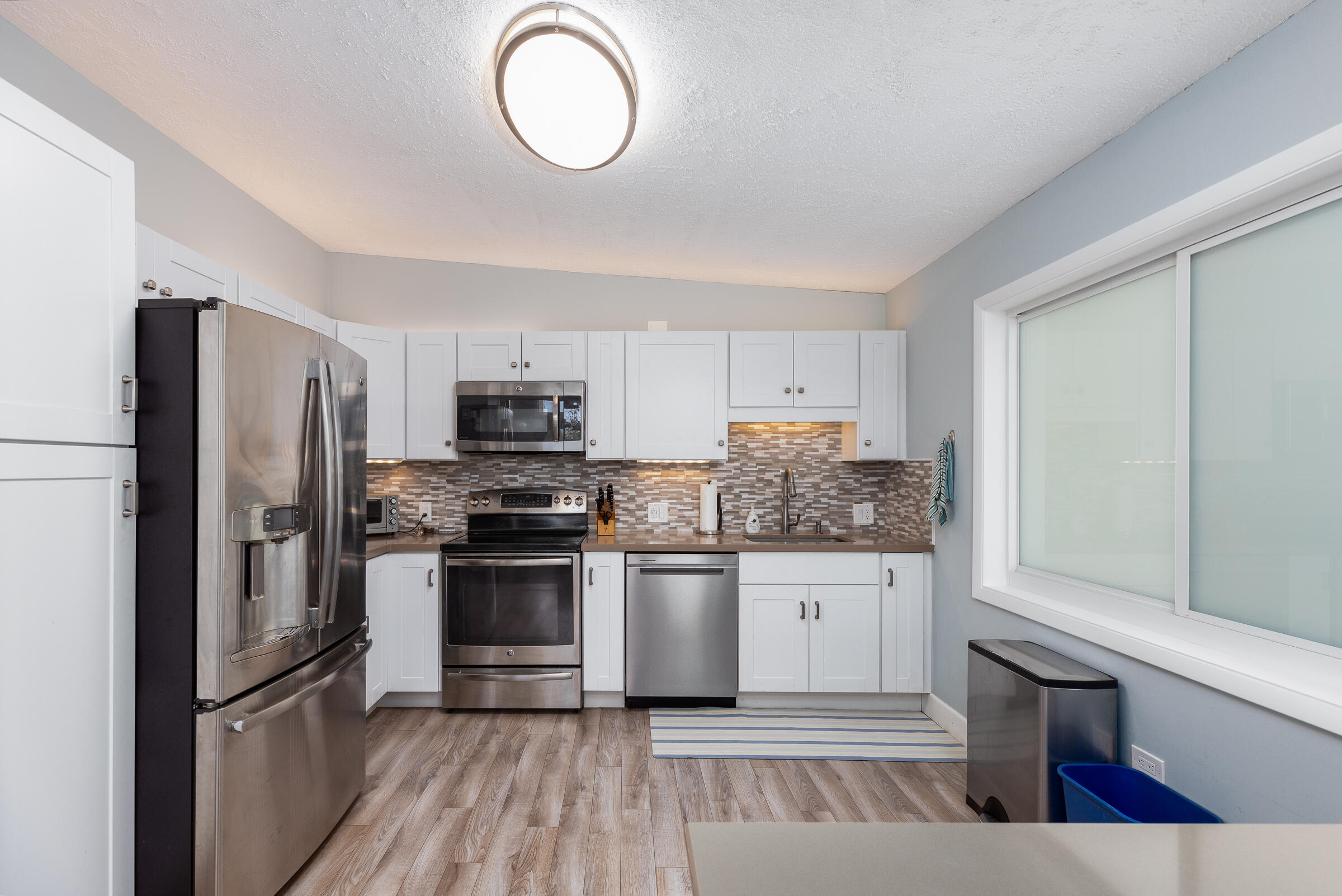 39 Lake Shore Drive Key Largo, FL 33037 - Photo 6 of 47 a kitchen with stainless steel appliances granite countertop a stove top oven a sink and a refrigerator
