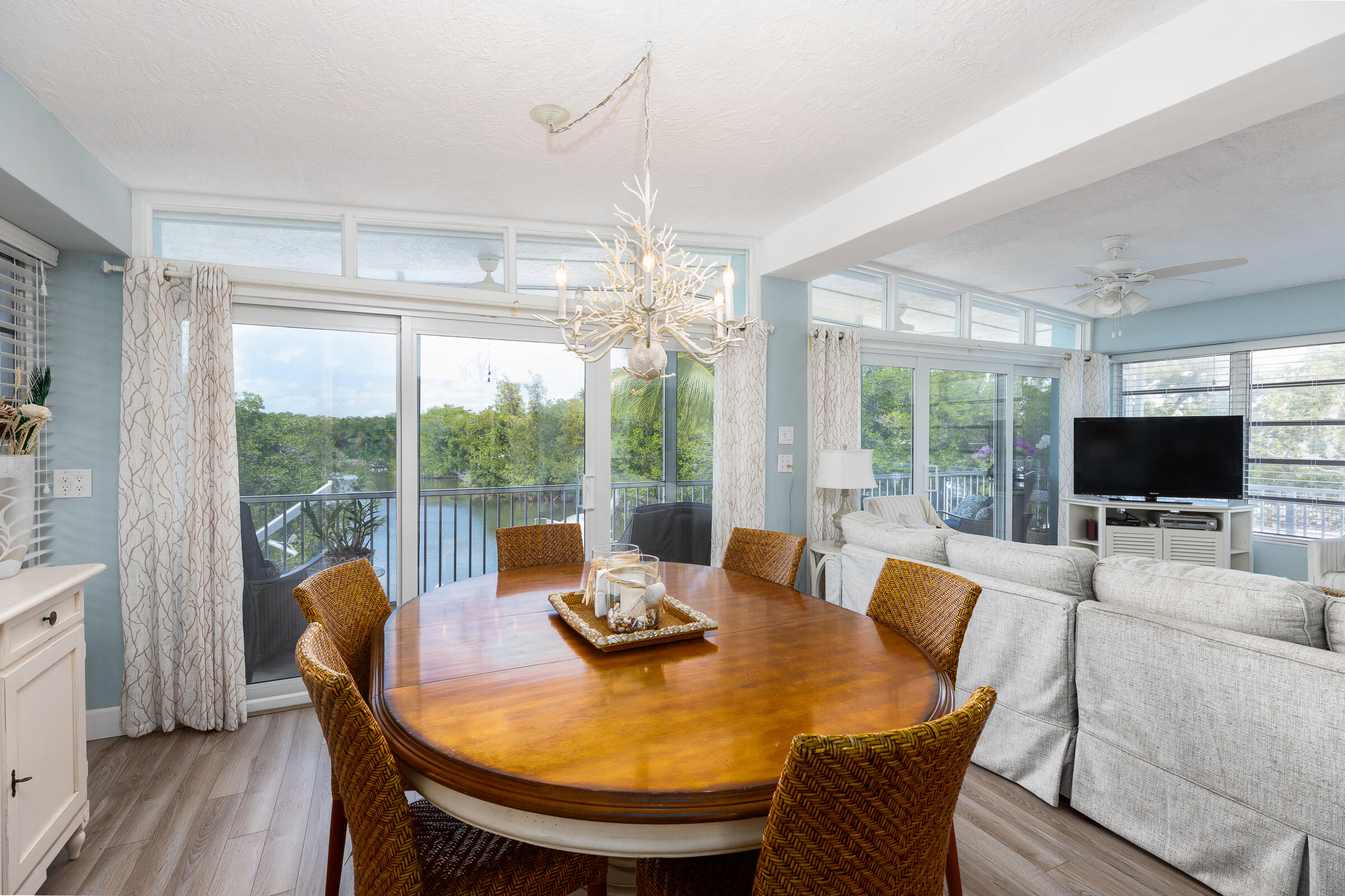 39 Lake Shore Drive Key Largo, FL 33037 - Photo 7 of 47 a view of a dining room with furniture window and wooden floor