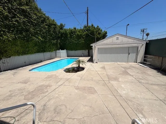a view of a backyard of the house