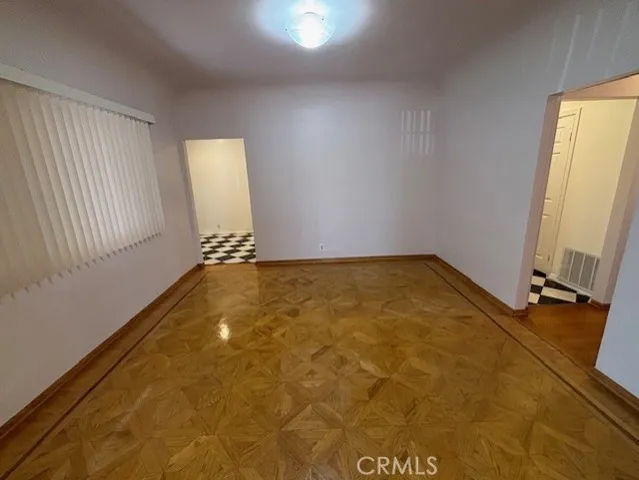 a view of room with window and hardwood