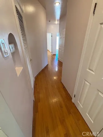 a view of a hallway view with staircase