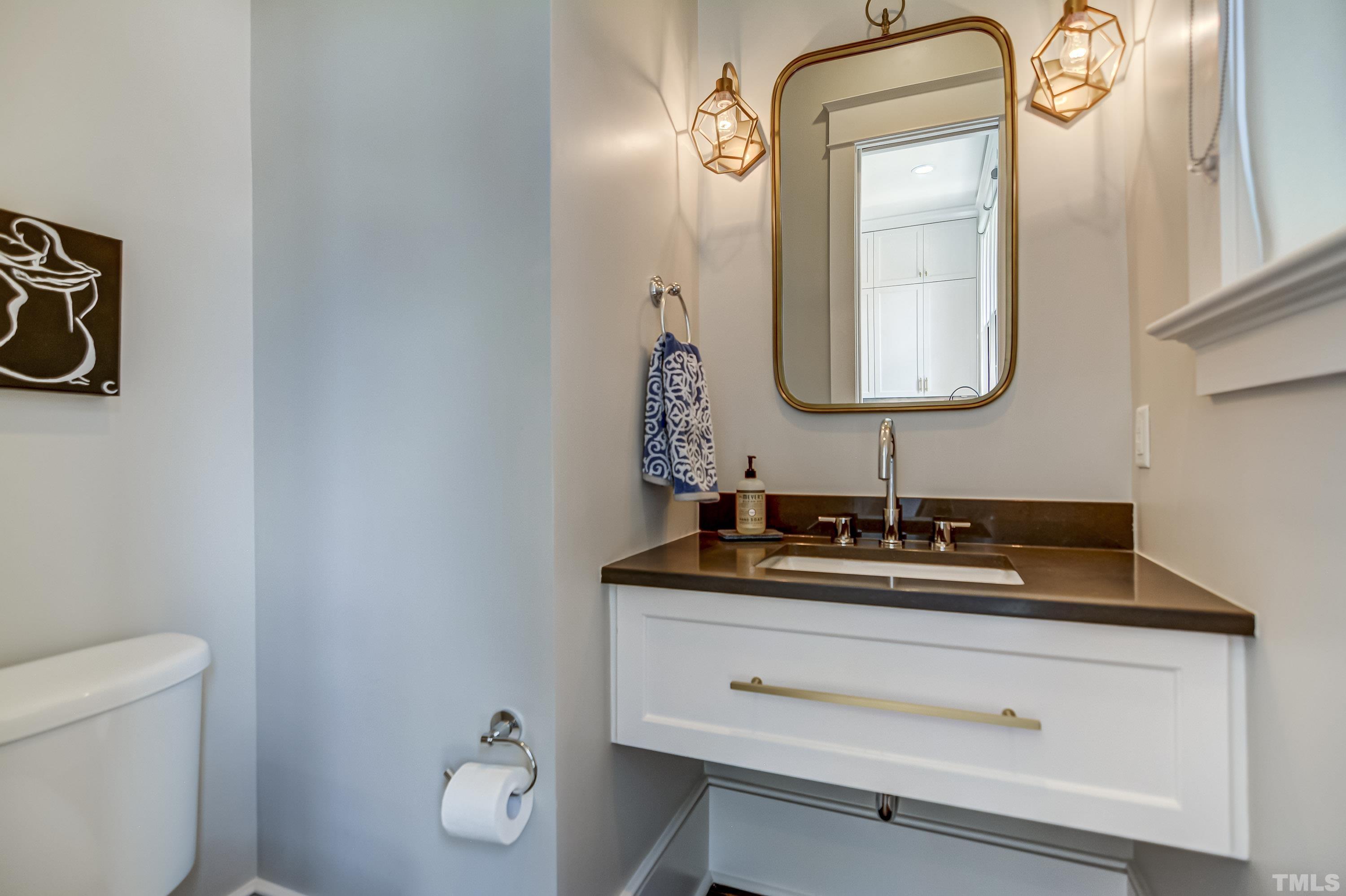 118 South East Street Raleigh, NC 27601 - Photo 18 of 40 a bathroom with a sink and a mirror