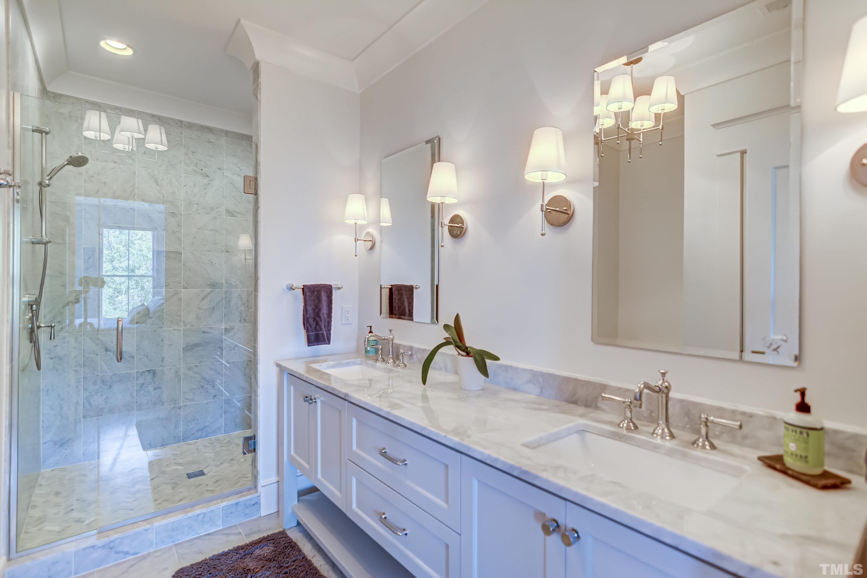 118 South East Street Raleigh, NC 27601 - Photo 21 of 40 a bathroom with a granite countertop sink mirror and double