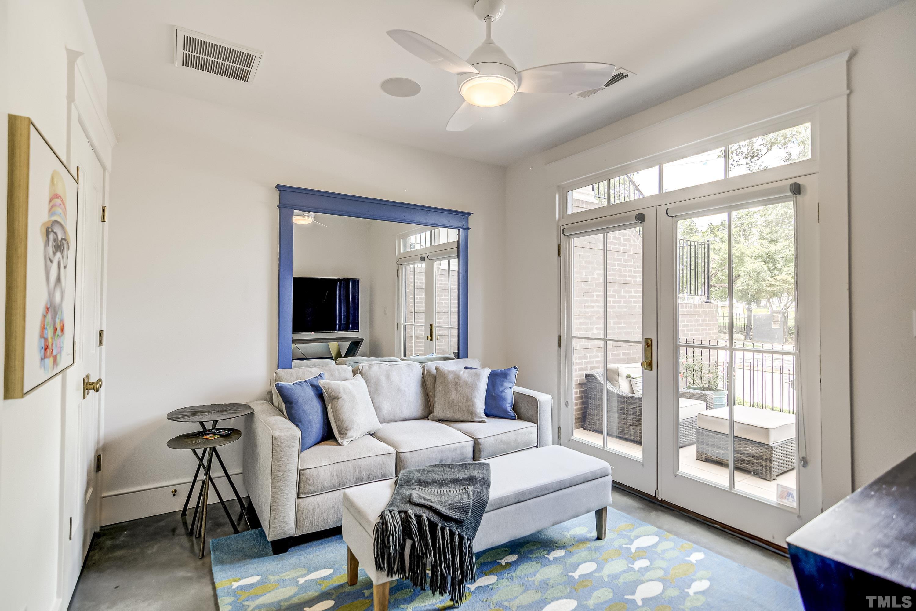 118 South East Street Raleigh, NC 27601 - Photo 27 of 40 a living room with furniture and a large window
