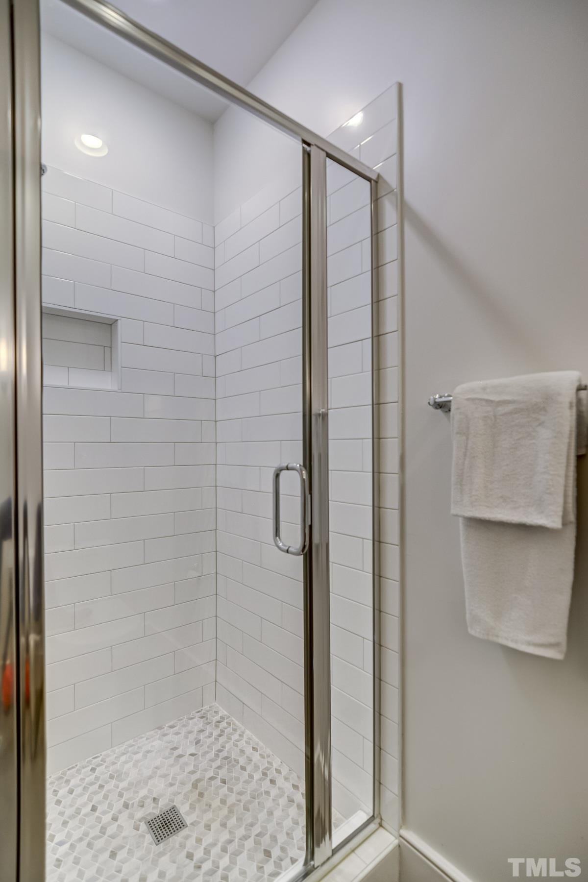 118 South East Street Raleigh, NC 27601 - Photo 30 of 40 a bathroom with a shower and a sink