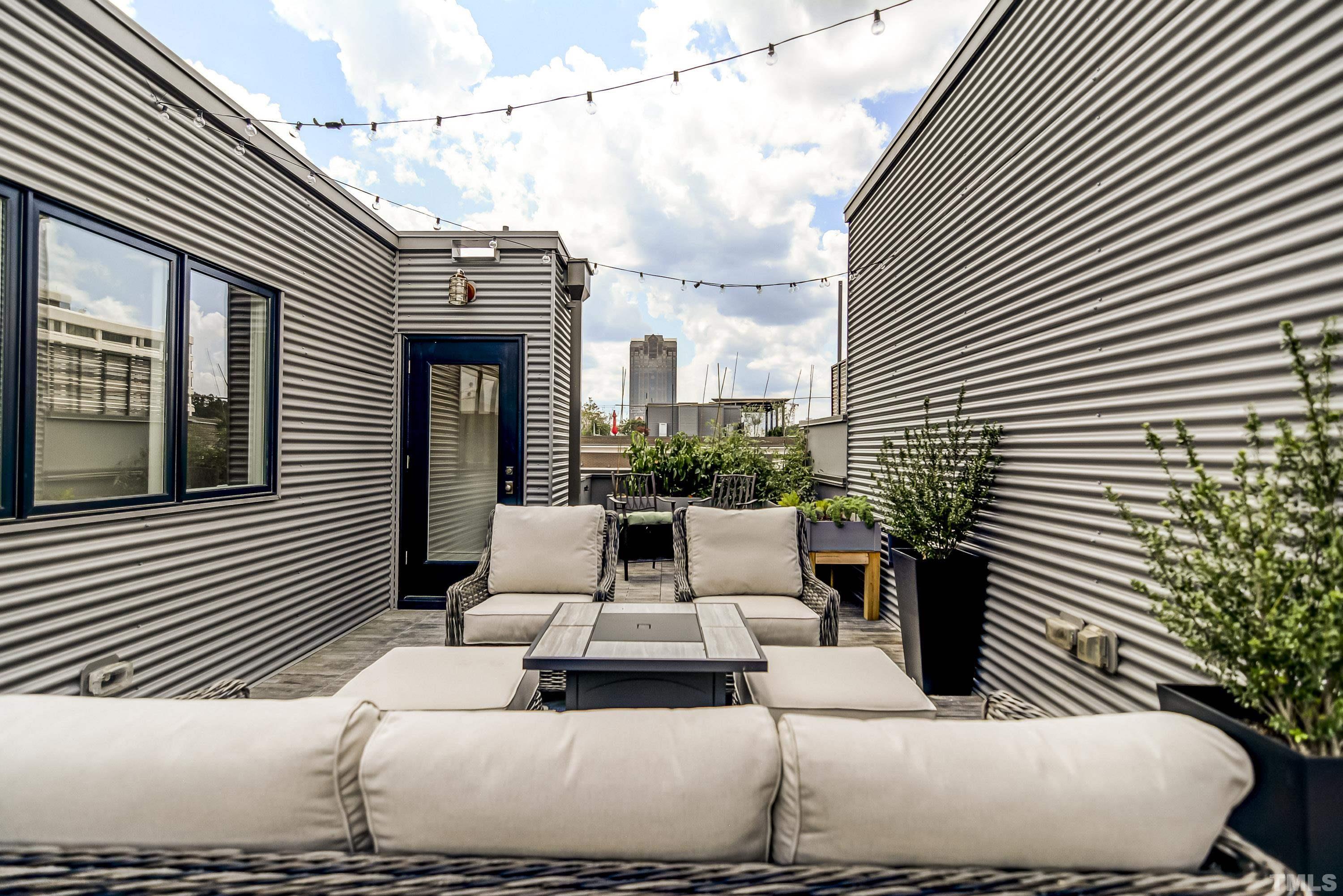 118 South East Street Raleigh, NC 27601 - Photo 36 of 40 a balcony with furniture and a potted plant