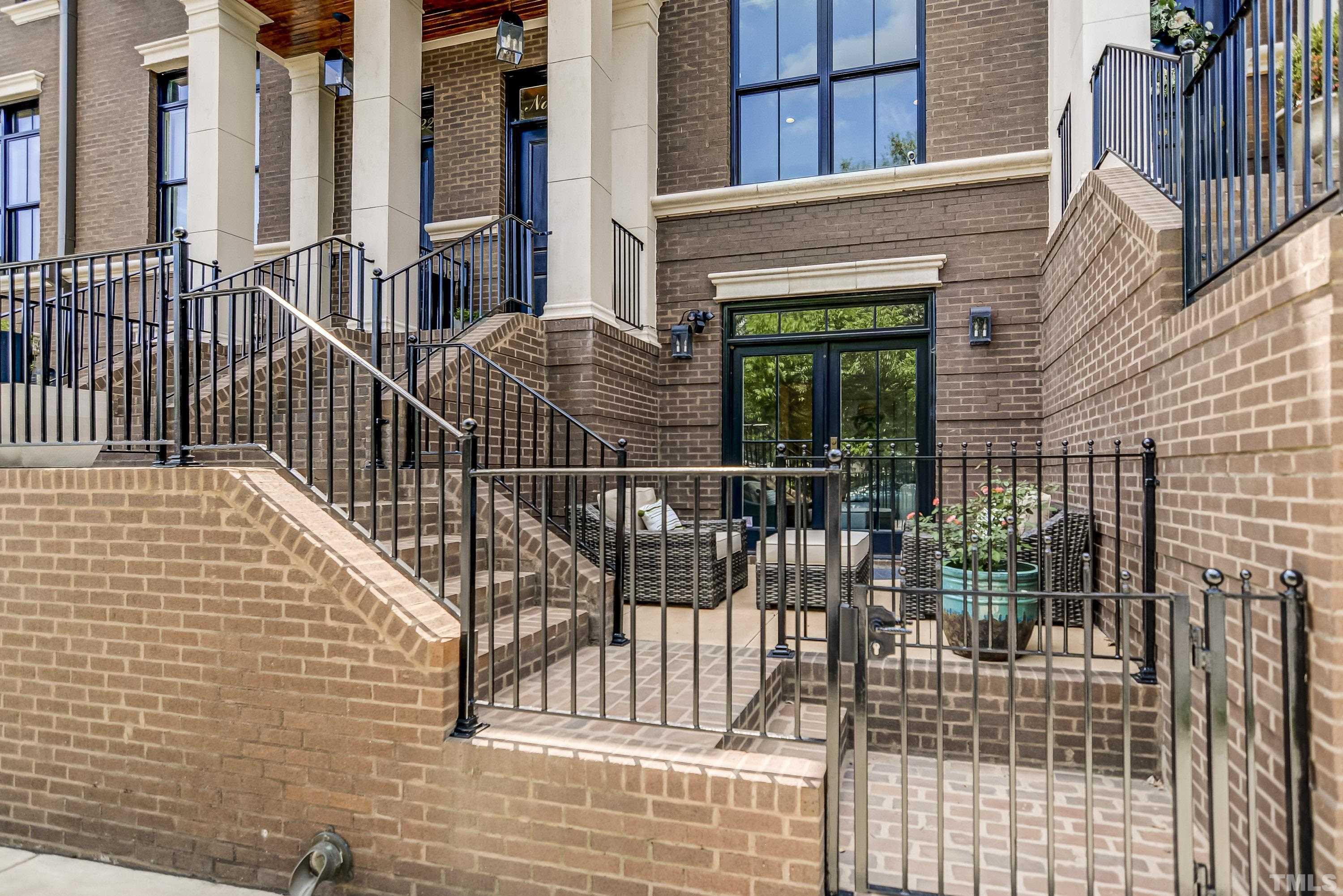 118 South East Street Raleigh, NC 27601 - Photo 4 of 40 a view of a balcony with a potted plant