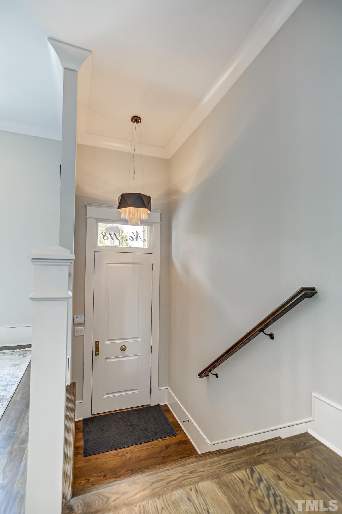 118 South East Street Raleigh, NC 27601 - Photo 6 of 40 a view of a hallway with wooden floor