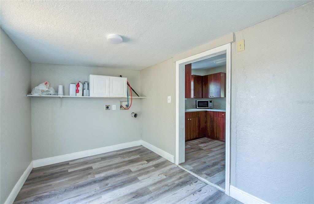 1516 East Waters Avenue Tampa, FL 33604 - Photo 20 of 25 a view of hallway with wooden floor