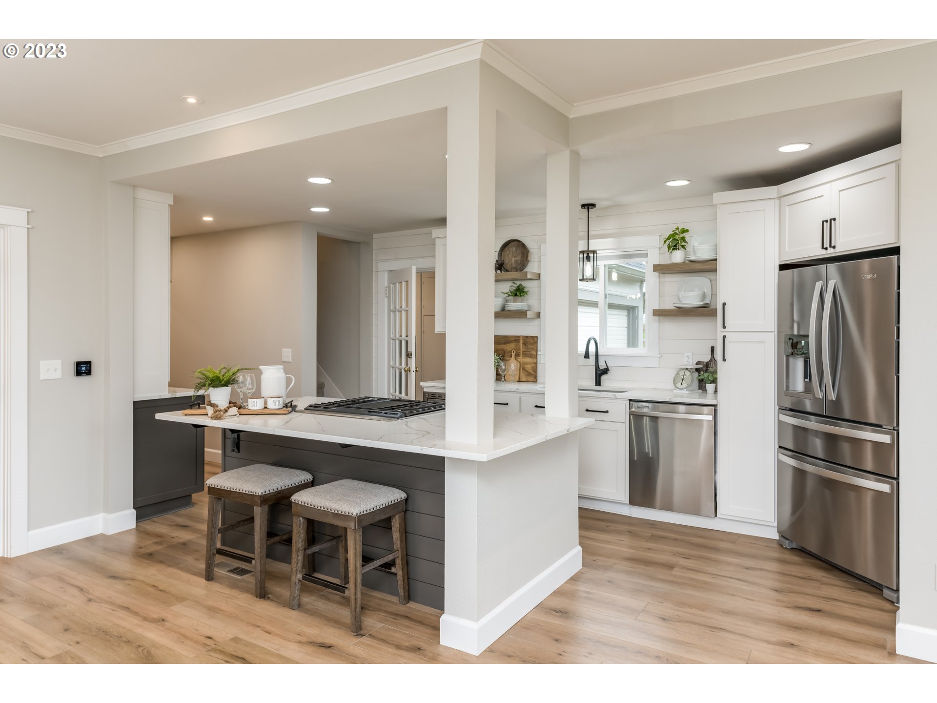 8951 South Schneider Road Canby, OR 97013 - Photo 11 of 39 a kitchen with stainless steel appliances kitchen island granite countertop a table and chairs in it