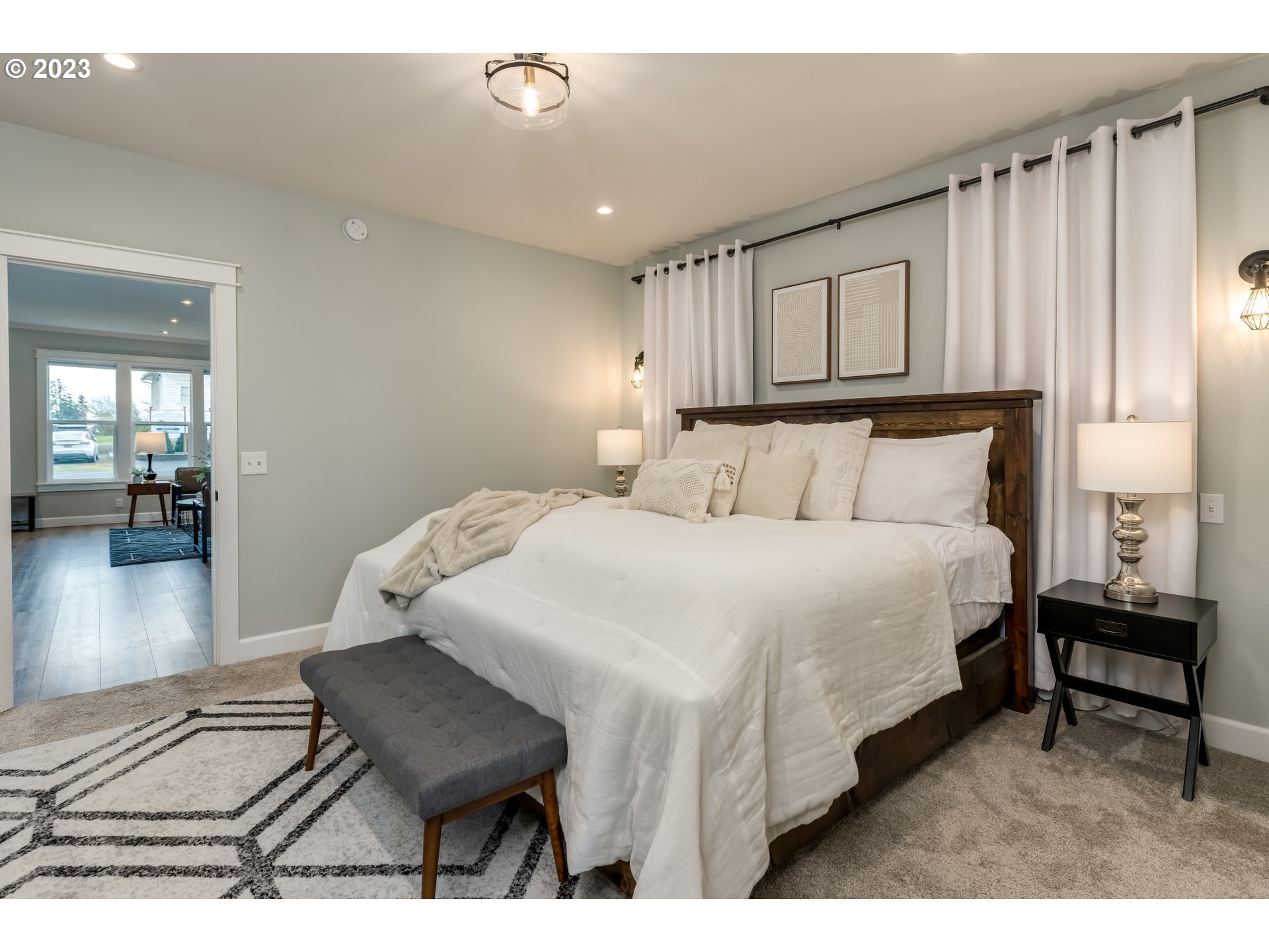 8951 South Schneider Road Canby, OR 97013 - Photo 16 of 39 a bedroom with a bed and wooden floor