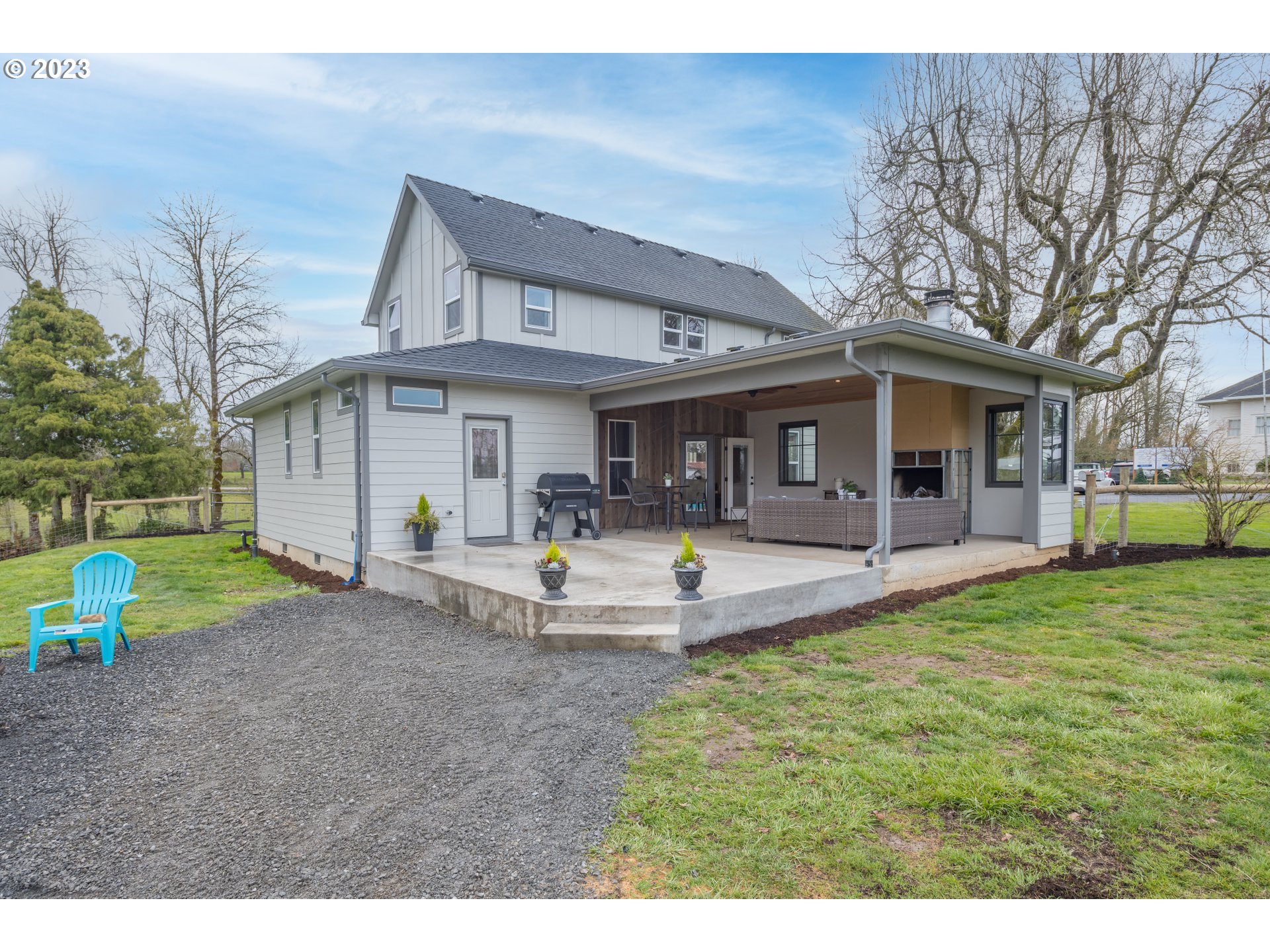 8951 South Schneider Road Canby, OR 97013 - Photo 2 of 39 a view of a house with backyard and a tree