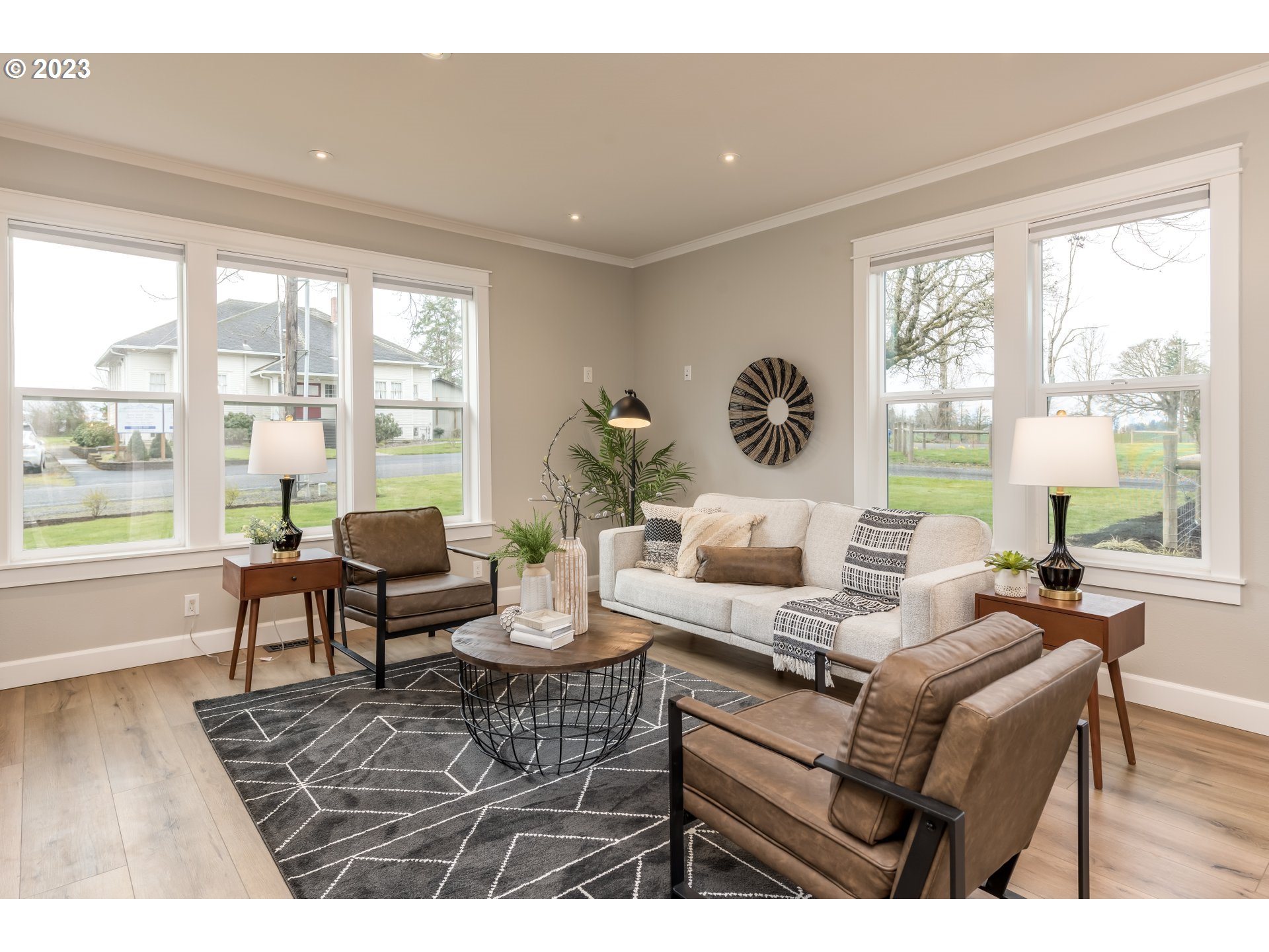 8951 South Schneider Road Canby, OR 97013 - Photo 4 of 39 a living room with furniture and a large window