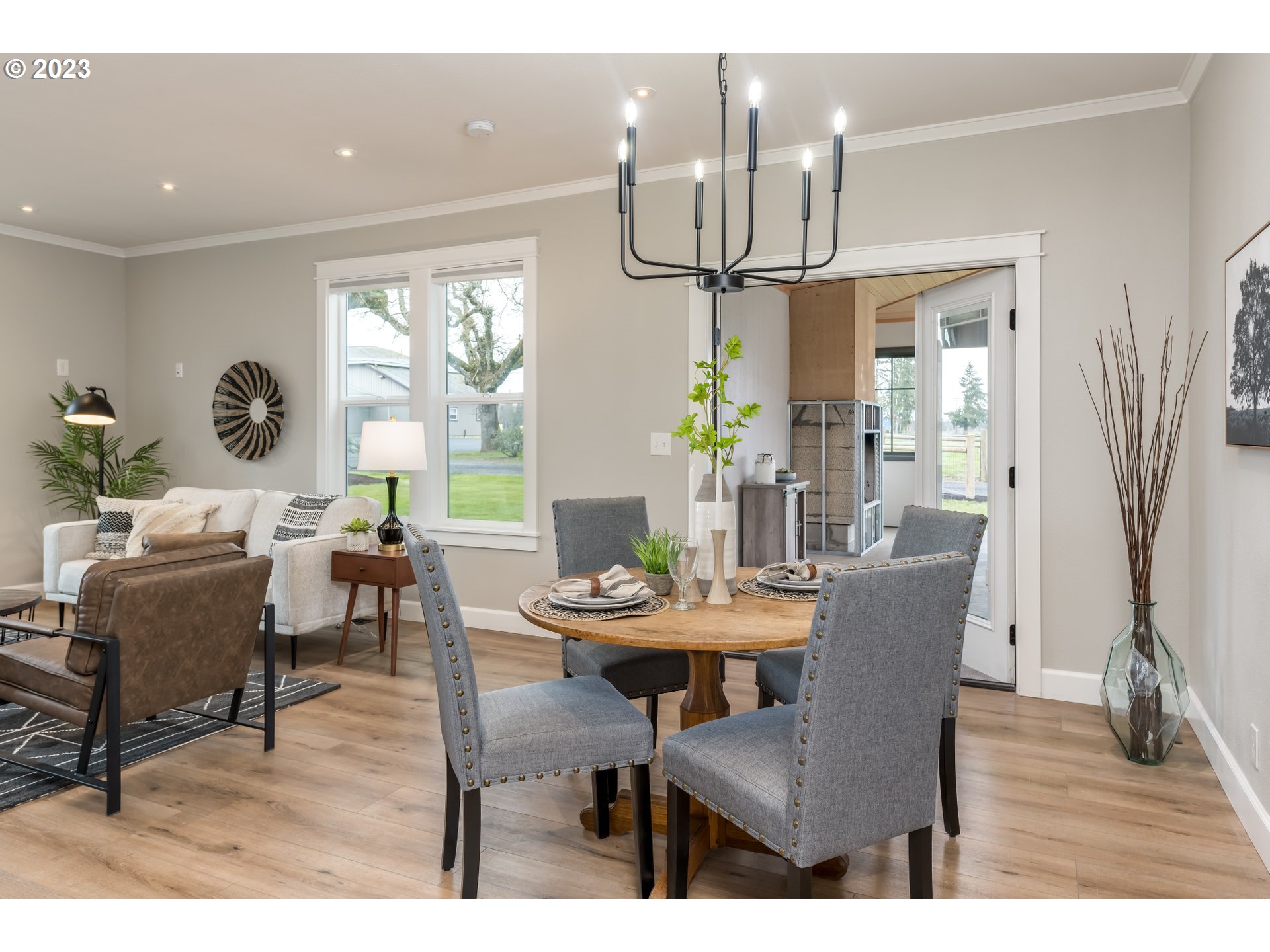 8951 South Schneider Road Canby, OR 97013 - Photo 6 of 39 a view of a dining room with furniture and wooden floor