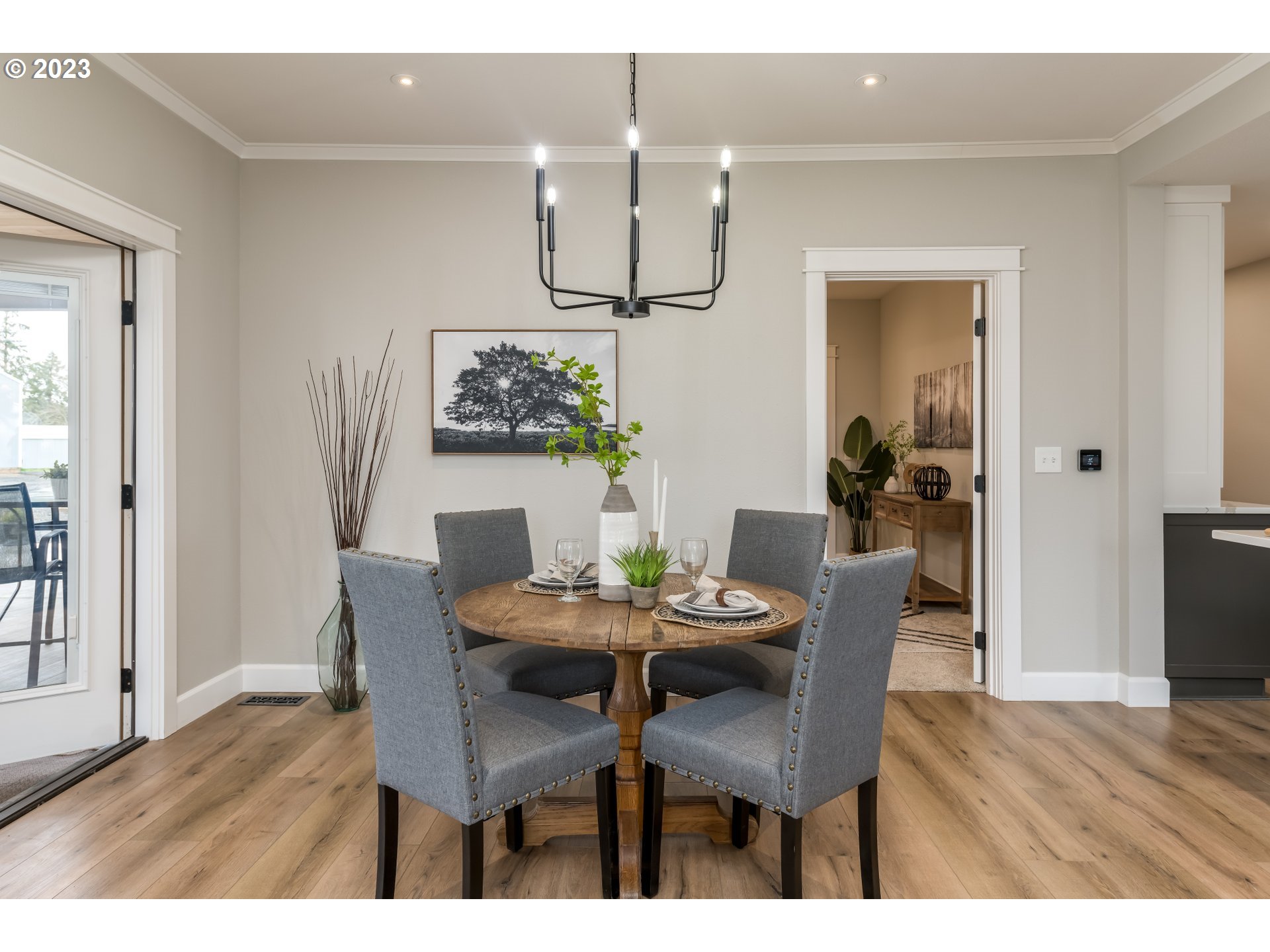 8951 South Schneider Road Canby, OR 97013 - Photo 7 of 39 a dining room with furniture potted plants and wooden floor