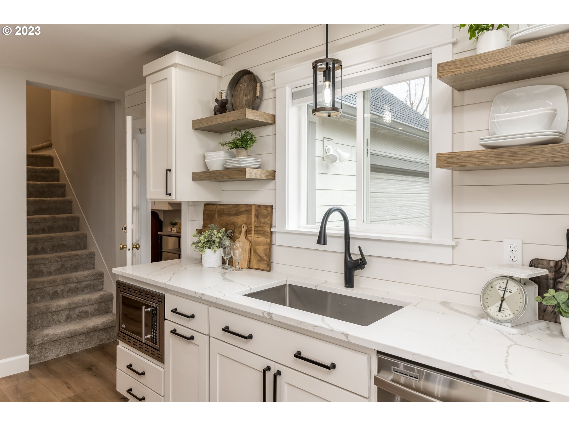 8951 South Schneider Road Canby, OR 97013 - Photo 9 of 39 a kitchen with stainless steel appliances a sink a stove and cabinets