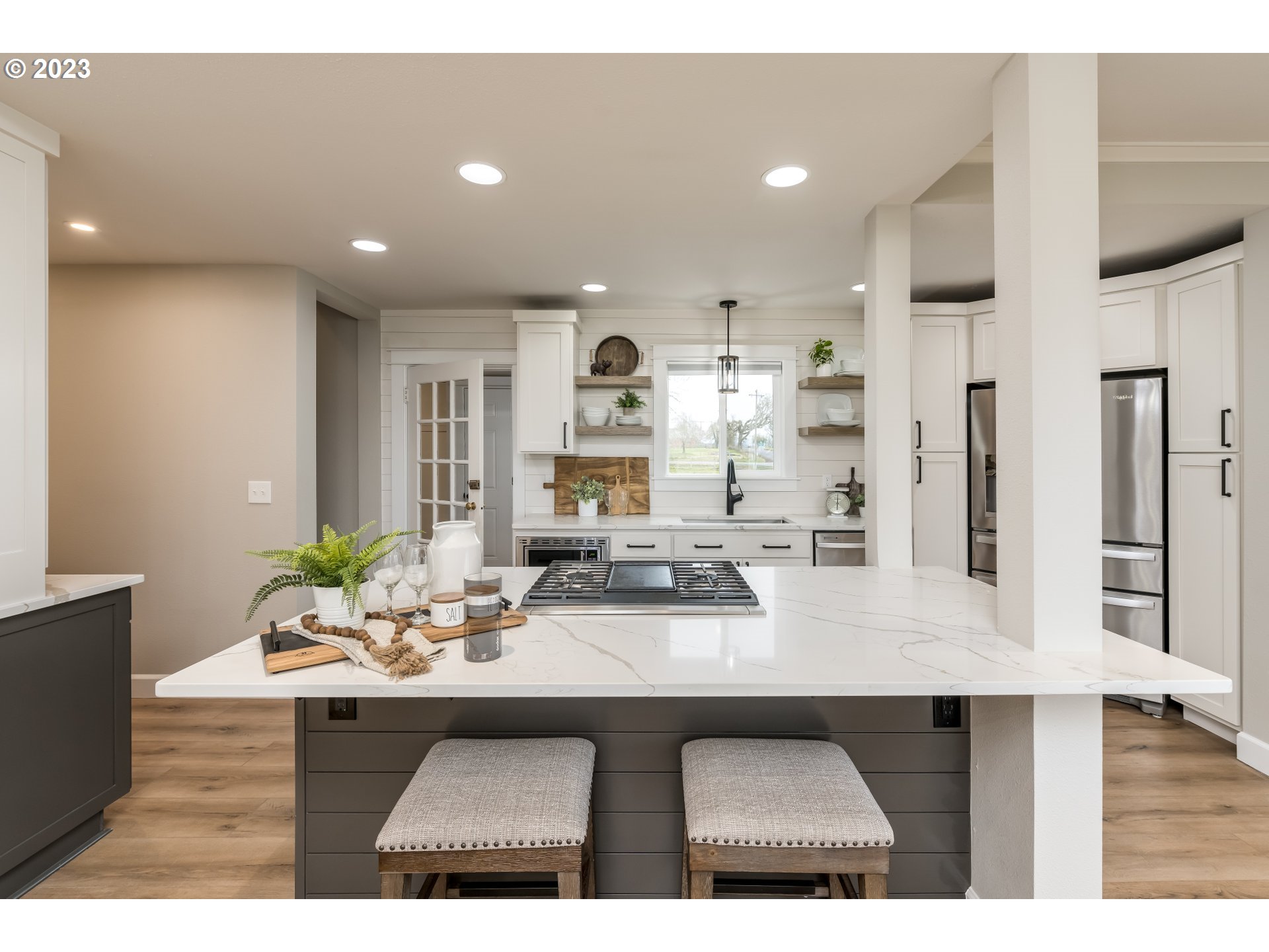 8951 South Schneider Road Canby, OR 97013 - Photo 10 of 39 a kitchen with kitchen island a sink appliances and a counter top space