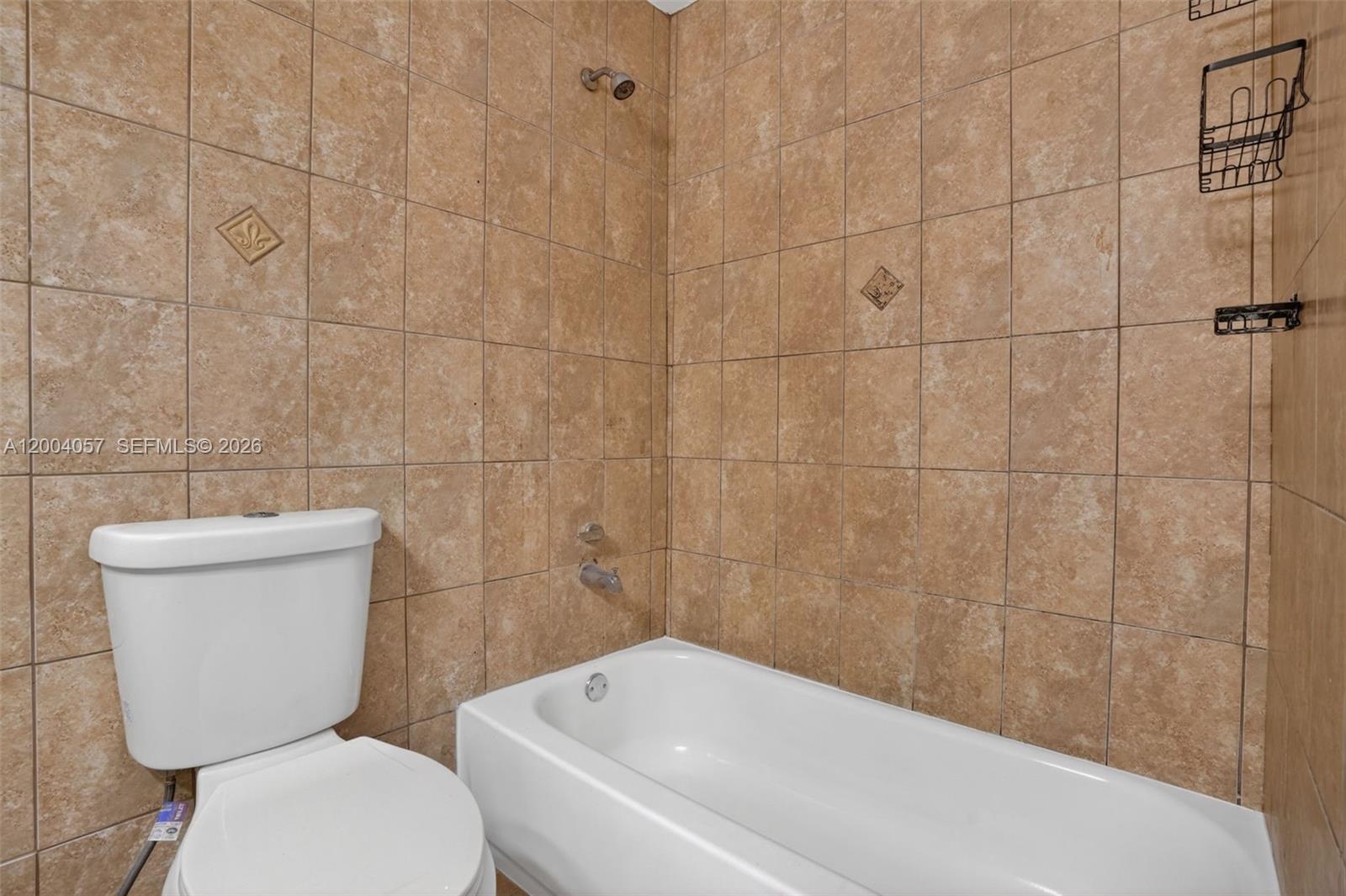 2276 West 56th Street, Unit 109 Hialeah, FL 33016 - Photo 15 of 22 a bathroom with a toilet and bathtub