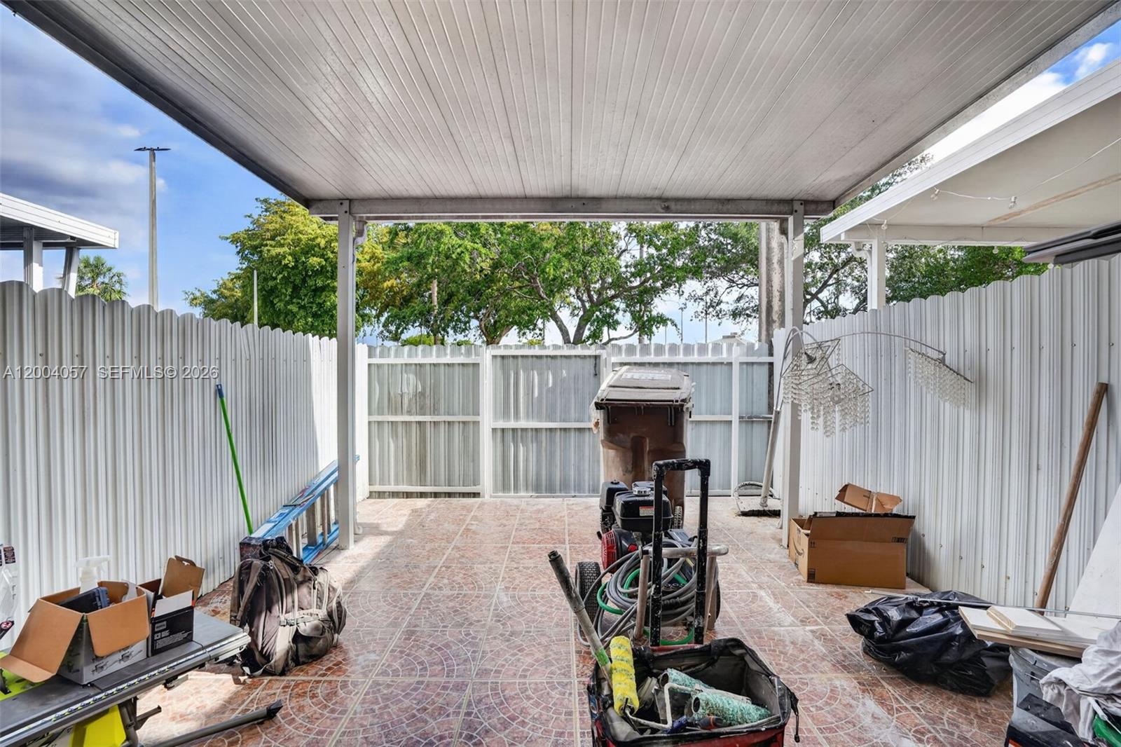 2276 West 56th Street, Unit 109 Hialeah, FL 33016 - Photo 19 of 22 a view of a room with gym equipment and a large window