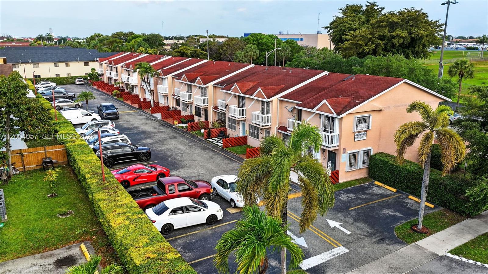 2276 West 56th Street, Unit 109 Hialeah, FL 33016 - Photo 22 of 22 an aerial view of multiple houses with yard
