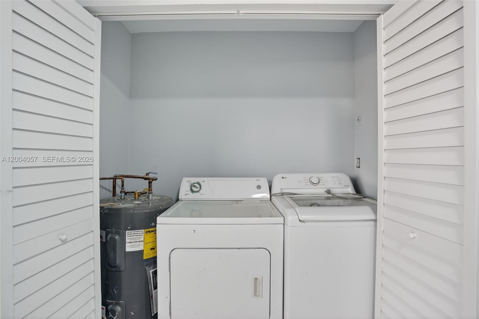 2276 West 56th Street, Unit 109 Hialeah, FL 33016 - Photo 9 of 22 a utility room with dryer and washer