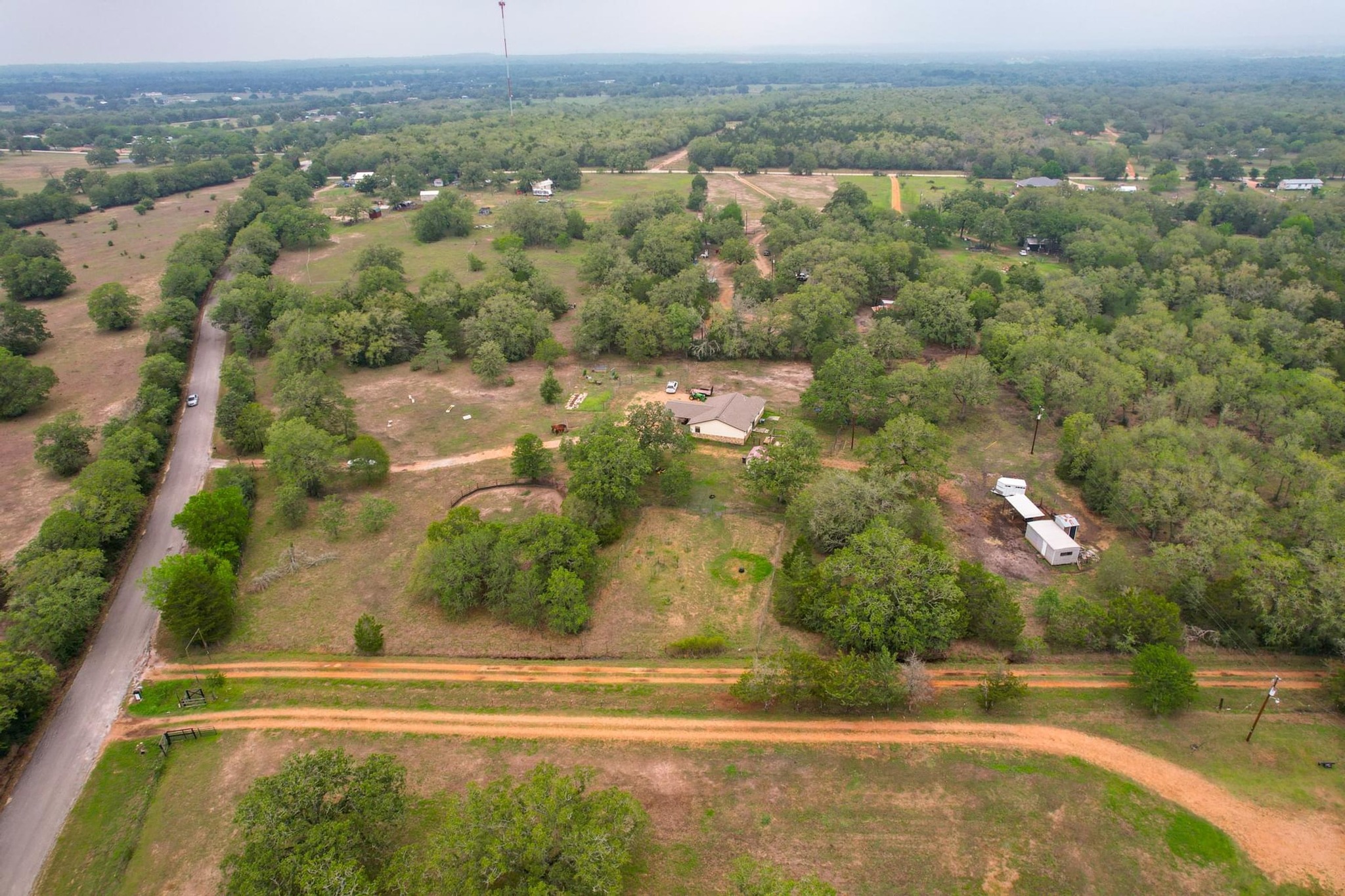 326 Zapalac Road Smithville, TX 78957 - Photo 8 of 8 an aerial view of residential houses with outdoor space and trees