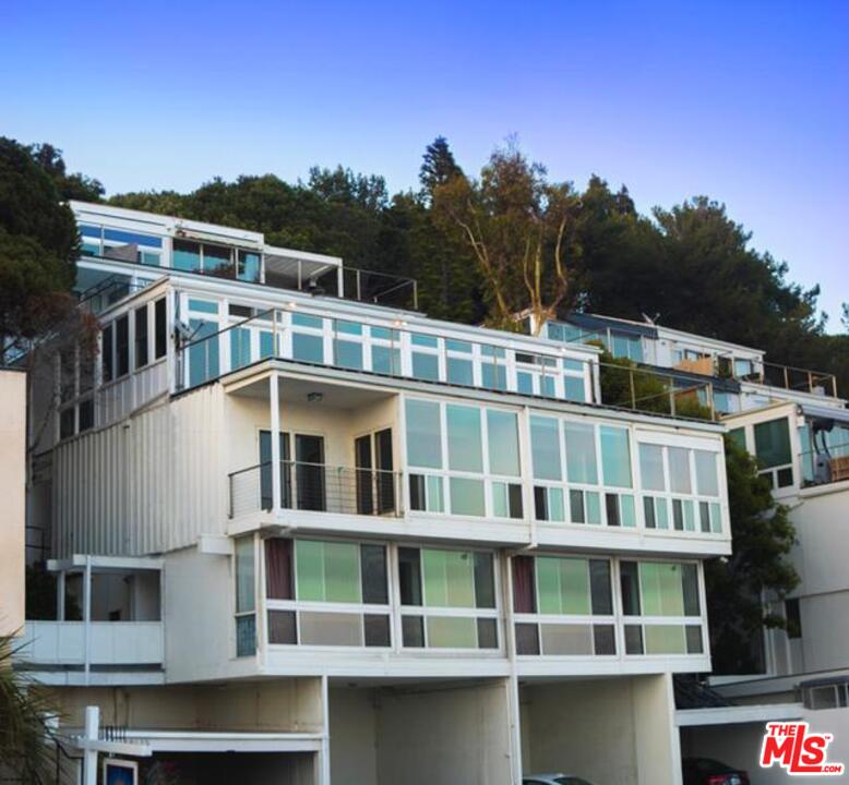 18125 Coastline Drive, Unit A Malibu, CA 90265 - Photo 1 of 9 a tall building in middle of a city