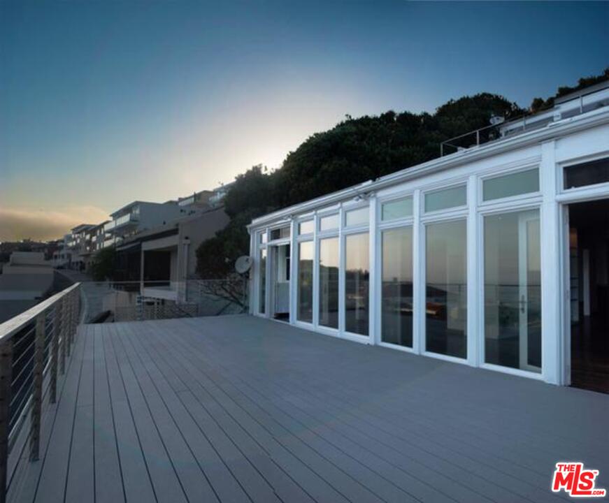 18125 Coastline Drive, Unit A Malibu, CA 90265 - Photo 9 of 9 a view of a house with a balcony
