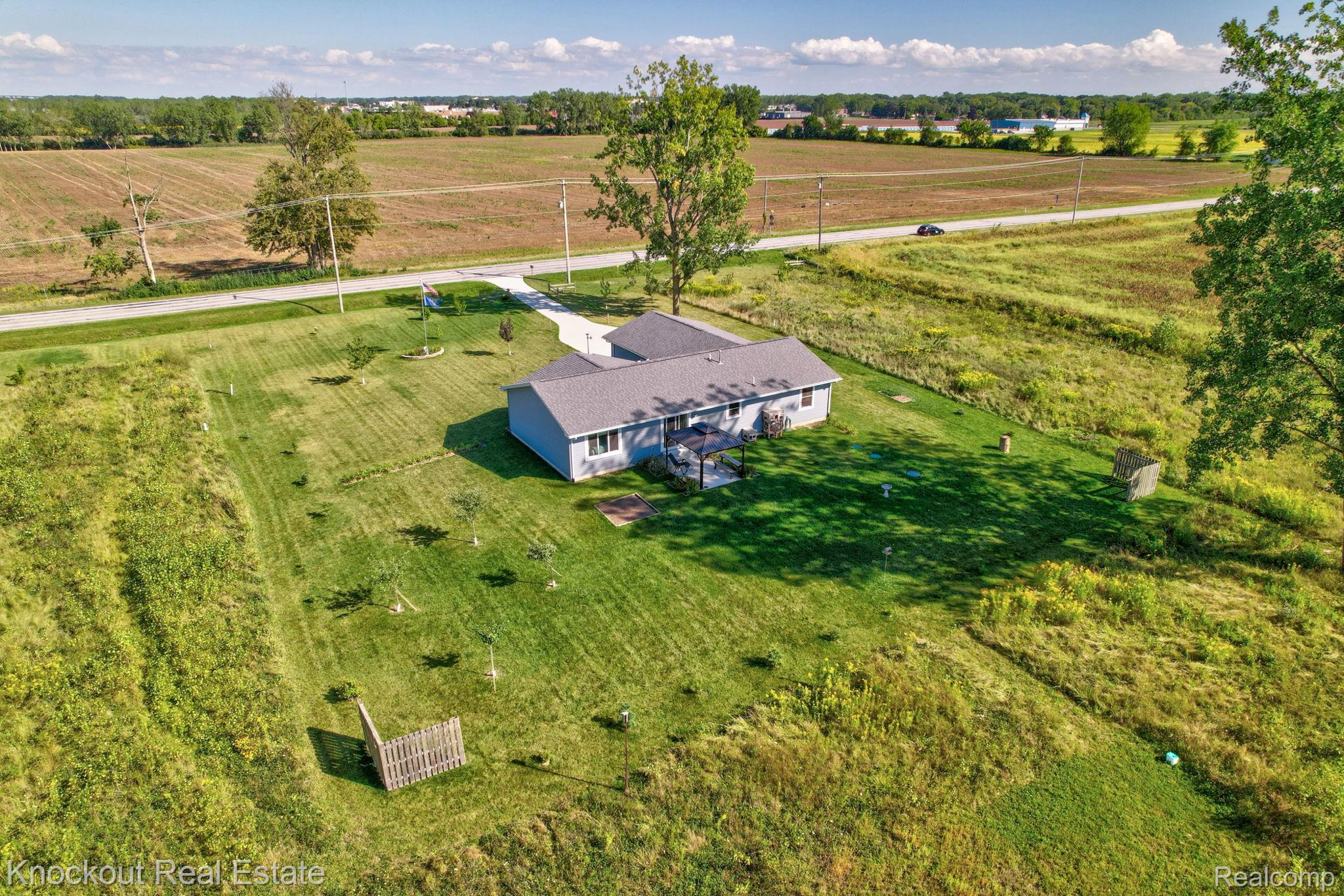 5727 Mackinaw Road Saginaw, MI 48604 - Photo 56 of 60 Ranch-style residence featuring a gray exterior siding and a dark gray shingle roof