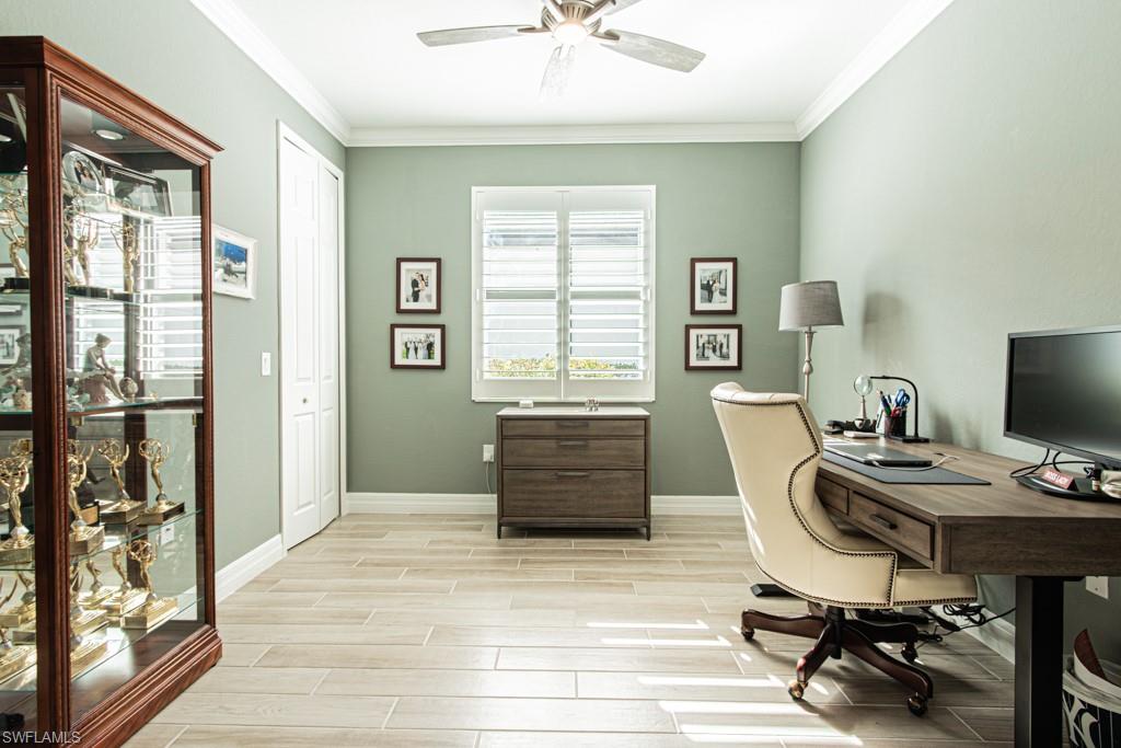 1869 Mustique Street Naples, FL 34120 - Photo 16 of 48 a workspace with furniture hardwood and a window