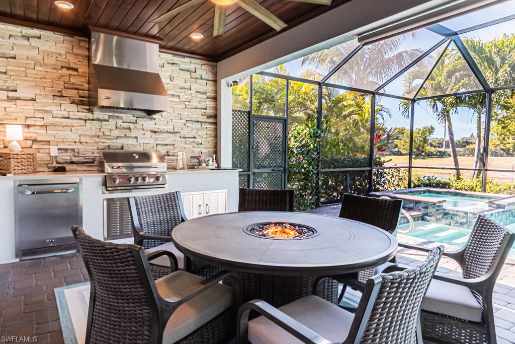 1869 Mustique Street Naples, FL 34120 - Photo 25 of 48 a view of a dining room with furniture window and outside view