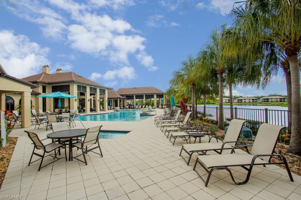 1869 Mustique Street Naples, FL 34120 - Photo 33 of 48 a view of a patio with swimming pool