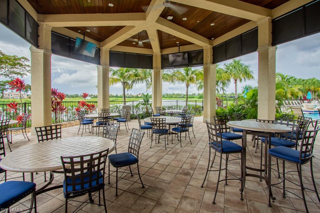 1869 Mustique Street Naples, FL 34120 - Photo 34 of 48 a view of an outdoor dining space with furniture