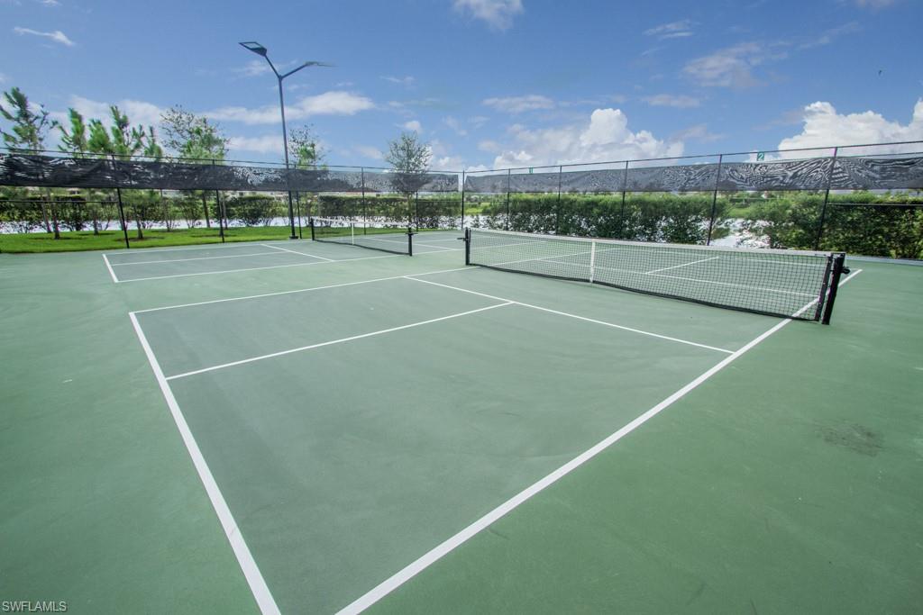 1869 Mustique Street Naples, FL 34120 - Photo 37 of 48 a view of a tennis court