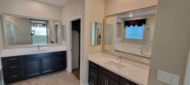 a bathroom with a bathtub and a shower