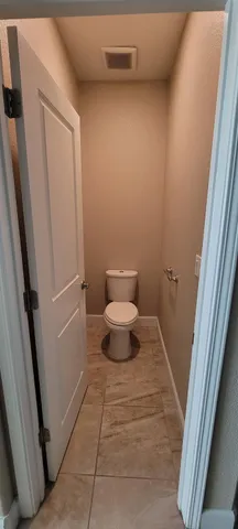 a view of a closet with an empty room