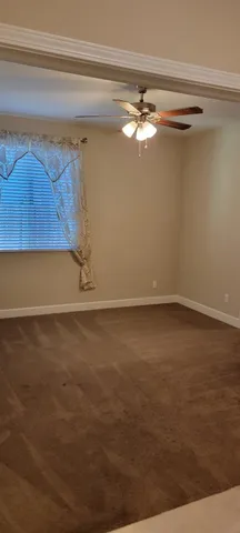 a view of a room with a window and a fireplace