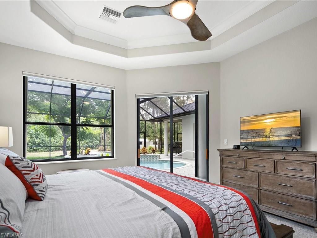 2360 19th Street Southwest Naples, FL 34117 - Photo 28 of 50 Bedroom with access to outside, a raised ceiling, crown molding, and a ceiling fan